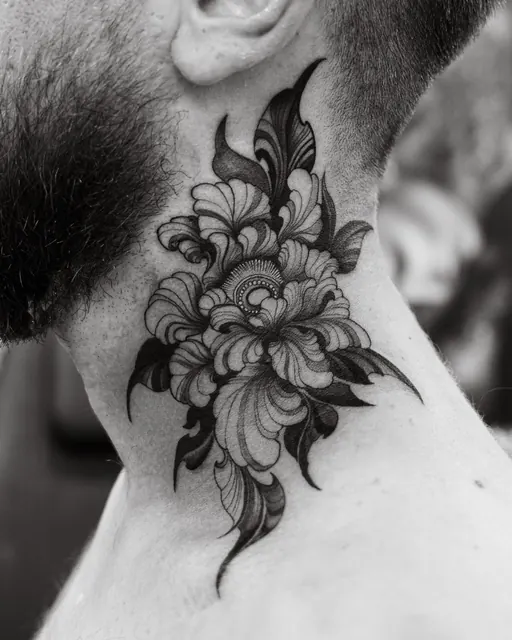 Blackwork floral tattoo on the side of the neck, healed