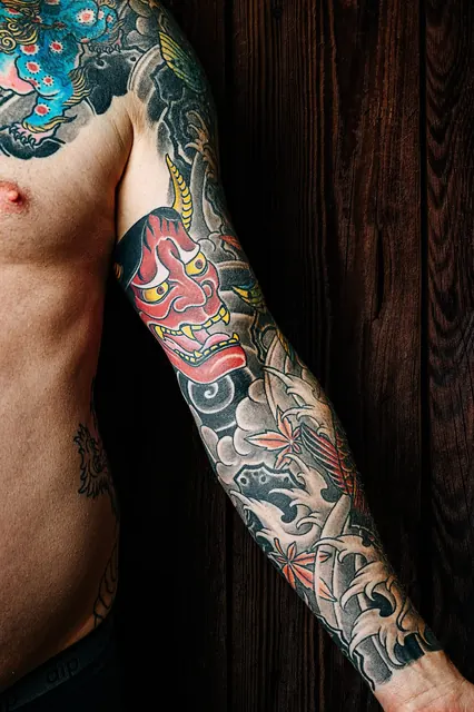Japanese color hannya mask sleeve on an arm and chest, healed